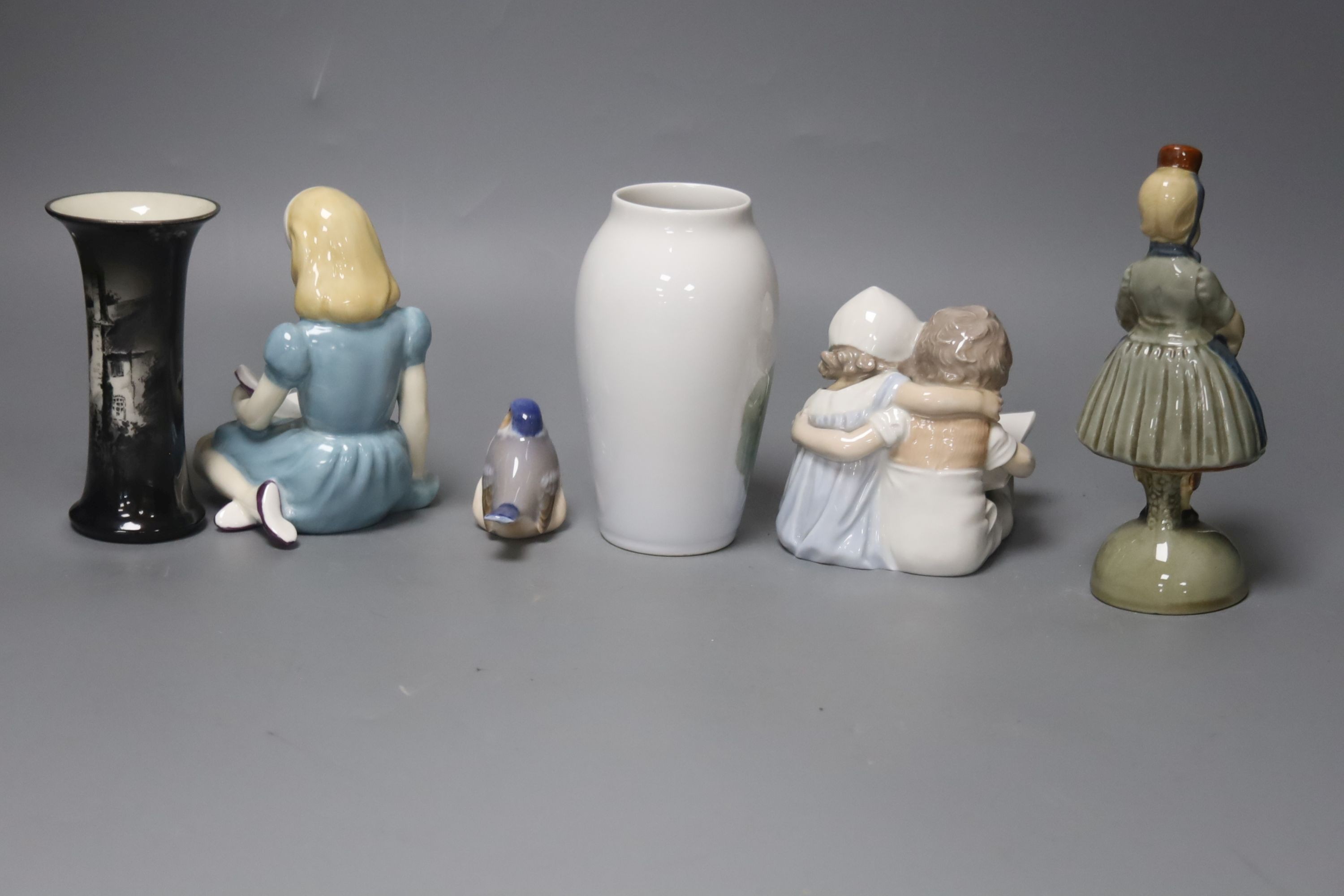 A group of figurines to include Royal Copenhagen, Doulton etc., a Royal Copenhagen vase and a Royal Worcester vase, 16cm